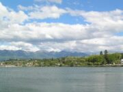 Confederated Salish and Kootenai Tribes open 400 Horses Casino in Montana An image of Polson, Montana with a lake in the foreground and mountains in the background.
