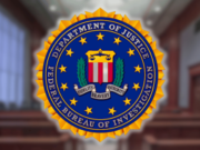 Justice Department contractor sentenced after gambling away government phone fraud proceeds FBI seal displayed inside courtroom during federal fraud investigation involving Justice Department contractor phone theft gambling scheme