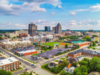New Lumbee website explains upcoming tribal gaming amendment vote before June Aerial view of downtown Greensboro, North Carolina, featuring the city skyline, baseball stadium, commercial buildings, and surrounding neighborhoods. New Lumbee website explains upcoming tribal gaming amendment vote before June