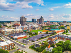 New Lumbee website explains upcoming tribal gaming amendment vote before June Aerial view of downtown Greensboro, North Carolina, featuring the city skyline, baseball stadium, commercial buildings, and surrounding neighborhoods. New Lumbee website explains upcoming tribal gaming amendment vote before June