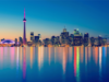 Ontario launches centralized gambling self-exclusion system covering all regulated gaming operators Toronto skyline at night featuring the CN Tower and illuminated downtown waterfront reflected on Lake Ontario, Canada cityscape panorama. Ontario launches centralized gambling self-exclusion system covering all regulated gaming operators