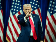 Trump declares prediction markets patriotic while state regulators wonder if they’re gambling Donald Trump points during campaign-style appearance surrounded by American flags amid debate over prediction markets and CFTC regulation.