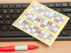 UK gambling regulator targets illegal betting and noncompliant machines with new bingo rules Online bingo card beside computer keyboard as UK Gambling Commission announces stricter gambling industry regulations and compliance rules