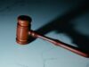 US soldier pleads not guilty in first prediction market insider trading case tied to Polymarket bets A coutroom gavel sitting on a desk.
