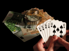 University researchers launch major independent UK gambling harms evidence center Person holding royal flush poker hand beside euro banknotes and luxury watch symbolizing gambling winnings, casino betting, and financial risk. University researchers launch major independent UK gambling harms evidence center